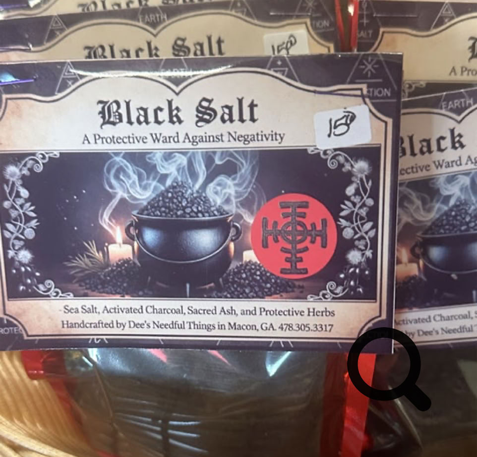 Stylish speakers and lighting fixtures showcased in a window display.